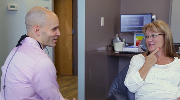 La Plata Maryland dentist talking to patient in dental chair
