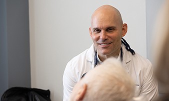 La Plata dentist talking to senior dental patient