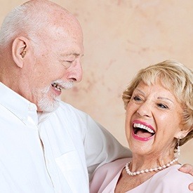 Smiling senior man and woman