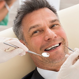 Man smiling at the dentist