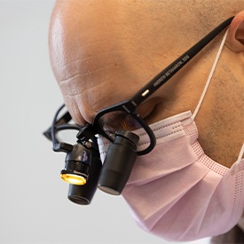 Implant dentist in La Plata showing patient an X-ray