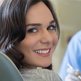 Smiling woman in dental chair