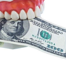 Dental mold holding money for the cost of dentures in La Plata