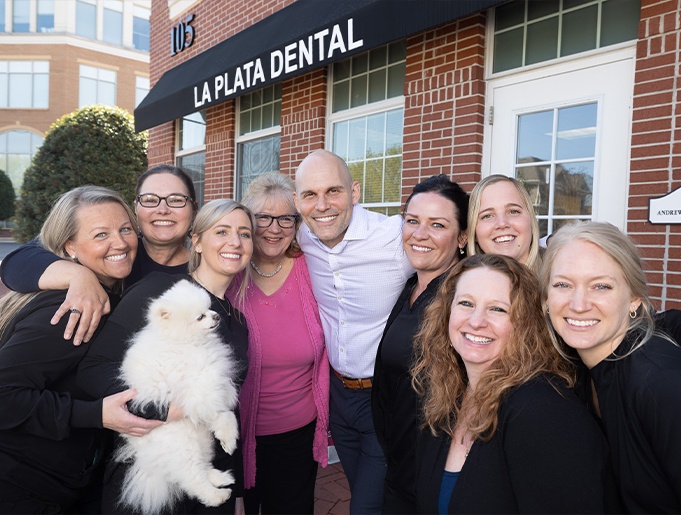 Dentist and dental team members outside of La Plata Dental office