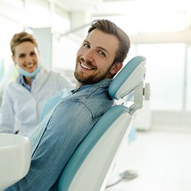 Man smiling while relaxing in treatment chair