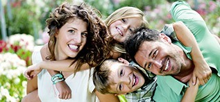 Family of four having fun outdoors