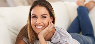 Relaxed woman laying on couch