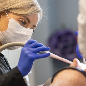 Man receiving in-office teeth whitening