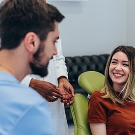 Woman smiling while talking to La Plata cosmetic dentist