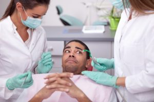 person afraid at the dentist's 