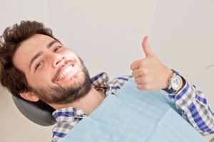 man with a thumbs up needing a root canal