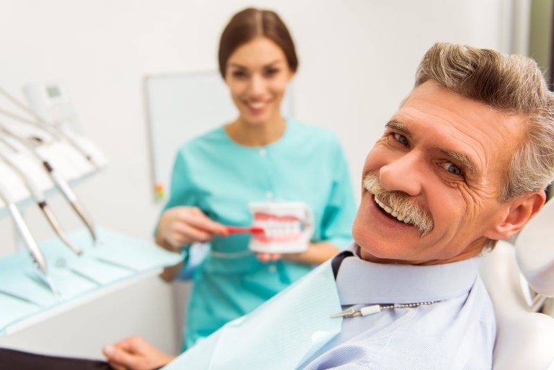 man at dental checkup with dentures in La Plata